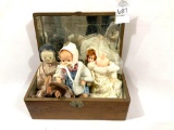 Wooden box and dolls