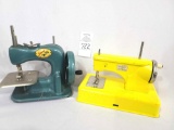 Two miniature metal sewing machines