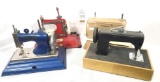 Four metal vintage miniature sewing machines