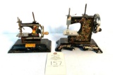 Two vintage child's size hand crank metal sewing machines