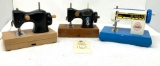 Four vintage plastic child size hand crank sewing machines