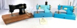 Three vintage child?s size hand crank sewing machines