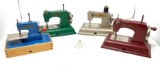 Four vintage Sew Master child size hand crank sewing machines