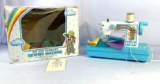 Vintage battery operated Rainbow Girl sewing machine