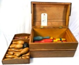 Vintage wooden bowling pins and balls in wooden box