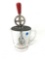 Clear antique beater jar with a red handle handle