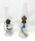 Two antique clear glass finger lamps