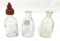 Three antique Doll-E-Toy by Amsco glass bottles