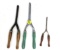 Three antique wooden handled curling irons