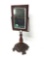 Antique mirror with a cast iron base