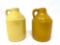 Two vintage yellow crock jugs