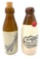 Two brown and white crock bottles, W. Ambrose ginger beer