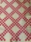 Pink and white block quilt