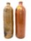 Two antique crock bottles