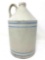 Antique white crock jug with blue and white lines