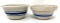 Two antique crock bowls with blue lines