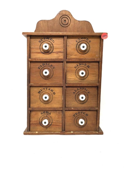 Vintage wooden spice cabinet with eight drawers and porcelain handles