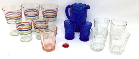 Vintage shot glasses and a small blue pitcher and glasses
