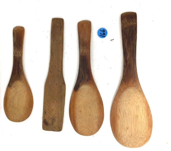 Four antique wooden paddles