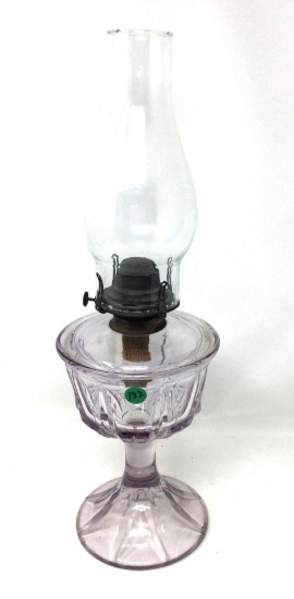 Vintage oil lamp with a clear purple base