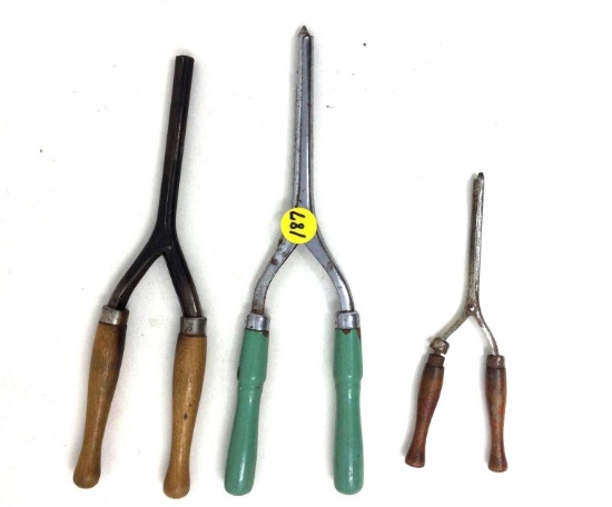 Three antique wooden handled curling irons
