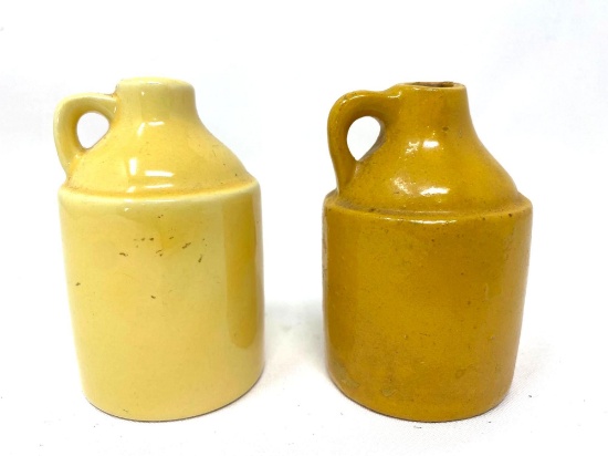 Two vintage yellow crock jugs