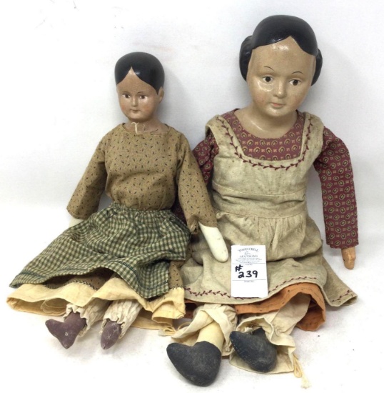 Two antique dolls with a bisque head and cloth body