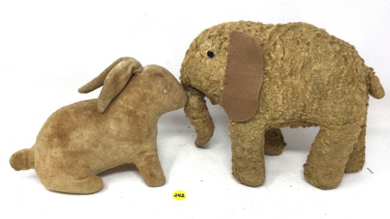 Antique stuffed elephant and a rabbit