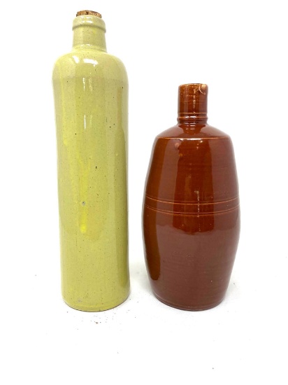 Two vintage crock bottles