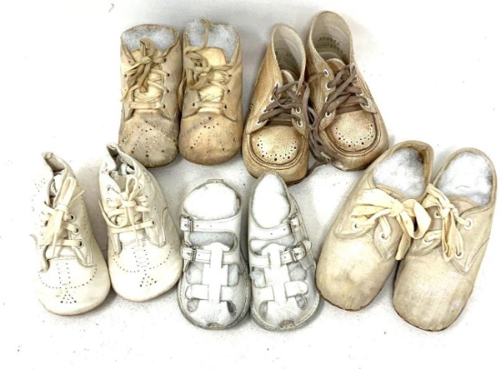 Five pair of vintage baby shoes