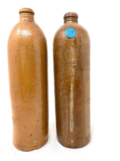 Two antique crock jugs/bottles
