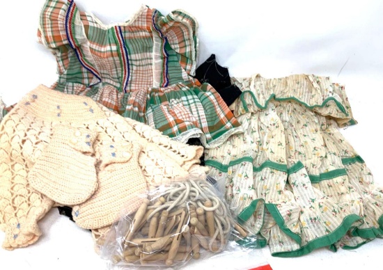 Vintage toddler dresses, clothes pins and knitted booties and sweater