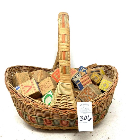 Vintage woven basket and children"s wooden blocks