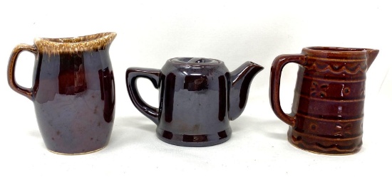 Brown vintage creamers and tea pot