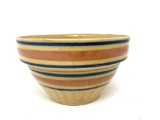 Antique crock bowl with blue and pink lines