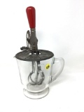Antique glass beater jar with red handle