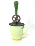Antique yellow milk glass beater jar with green handle