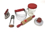 Antique red handled kitchen items