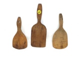 Three antique wooden butter paddles