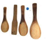 Four antique wooden paddles