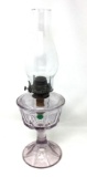 Vintage oil lamp with a clear purple base