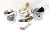 Four vintage shaving mugs and brushes