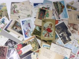 Antique postcards some with writing and postage