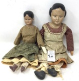 Two antique dolls with a bisque head and cloth body