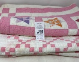 Two pink baby hand stitched quilts