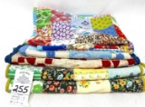 Five small quilted doll blankets