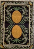 Hand stitched rug with pineapple design