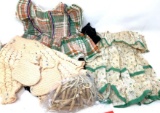 Vintage toddler dresses, clothes pins and knitted booties and sweater