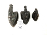 Three antique metal handled sad irons