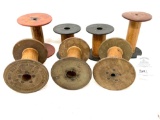 Seven antique wooden yarn spools